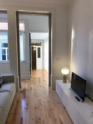 a living room with a couch and a television at Porto Ildefonso II in Porto