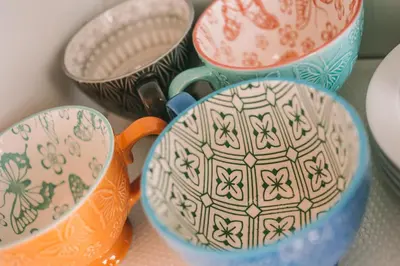 a group of cups and bowls on a table at Green House / Casa Verde in Porto