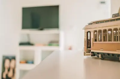 a toy train is sitting on a table at Green House / Casa Verde in Porto