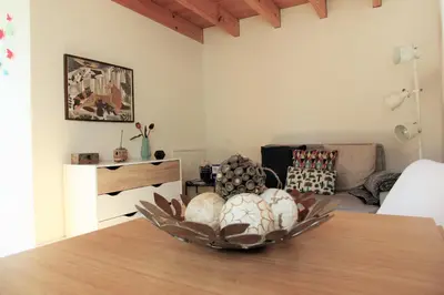a living room with a table with a bowl on it at Green House / Casa Verde in Porto