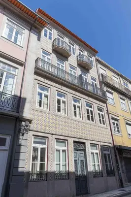 a staircase in a building with a metal railing at Domus 21 - Formosa in Porto