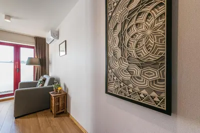 a living room with a couch and a painting on the wall at GuestReady - Crayon Walls Apartments in Porto