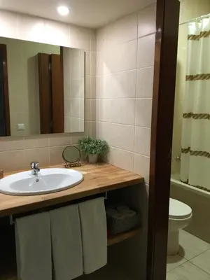 a room with a wooden door and a bench at Flats 323 apartments in Porto