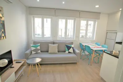 a living room with a couch and a table at Camões 691 Design Apartments by Porto City Hosts in Porto