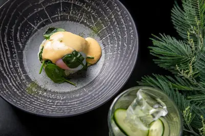 a plate of food on a table with a drink at InterContinental Porto - Palacio das Cardosas by IHG in Porto