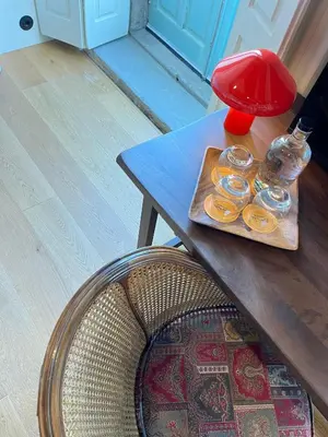 a wooden table with a tray of donuts on it at The House of Sandeman in Vila Nova de Gaia