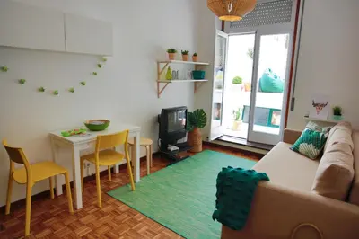 a living room with a couch and a table at Virtudes Patio in Porto