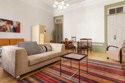 a living room with a couch and a table at HeartMade Loft & Heartmade Studio in Porto