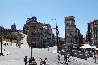 a group of people crossing a street in a city at OHH - Ganesha studio- Oporto Center in Porto