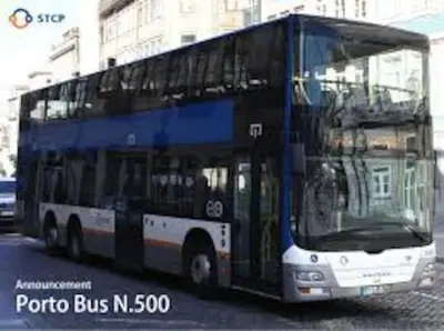 a blue double decker bus on a city street at OHH - Ganesha studio- Oporto Center in Porto