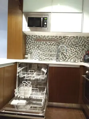 a dishwasher in a kitchen with a microwave at PATH Dukes Apartment in Porto