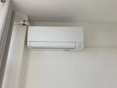 a white air conditioner on a wall in a room at PATH Biblioteca Apartment in Porto