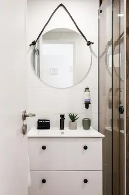 a bathroom with a sink and a mirror at Porto Essence in Porto