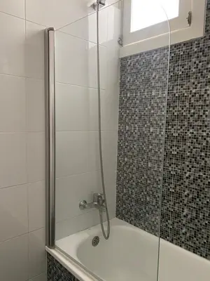 a white bathroom with a sink and a toilet at GuestHouse Marquês in Porto