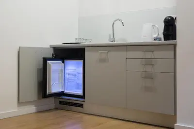 a kitchen with a sink and a window at Porto Bonjardim Apartments in Porto