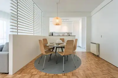 a dining room and kitchen with a table and chairs at GuestReady - Cn Apartment in Porto