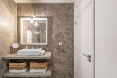 a bathroom with a sink and a mirror at GuestReady - Cn Apartment in Porto