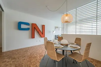a dining room with a table and chairs at GuestReady - Cn Apartment in Porto