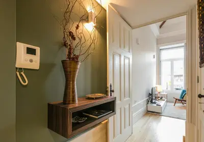 a hallway with a vase on a wooden cabinet at Visconde Mezzanine in Porto