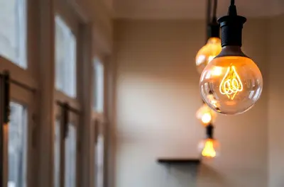 a group of lights hanging from a ceiling at METRO APARTMENT in Porto