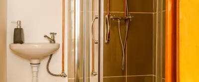 a bathroom with a sink and a shower at METRO APARTMENT in Porto