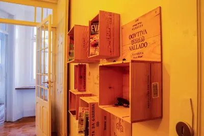 a book shelf filled with lots of books on a wall at METRO APARTMENT in Porto