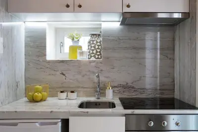 a kitchen with a sink and a counter top at BOUTIQUE Rentals - Little Treasure Studio in Porto
