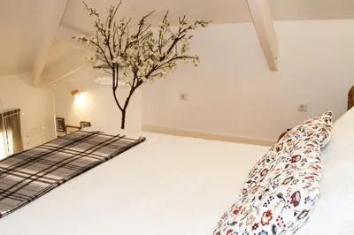 a bedroom with a bed with a tree on it at Porto Feeling in Porto