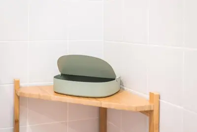 a toaster sitting on top of a wooden shelf at GuestReady - Charming Studio in Porto! in Porto