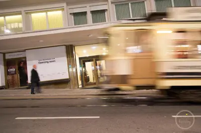 a man walking on the sidewalk in front of a store at Oporto Ceuta Residences - Residence 1 by We Do Living in Porto