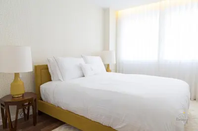 a bedroom with a white bed and a window at Oporto Ceuta Residences - Residence 1 by We Do Living in Porto
