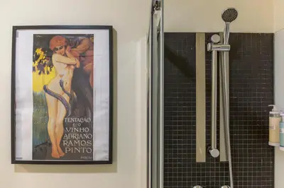 a picture of a movie on the wall in a bathroom at Oporto Between Walls by the center with A/C in Porto