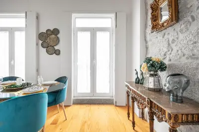 a bedroom with a large bed with a skylight at Downtown Historic Apartments in Porto