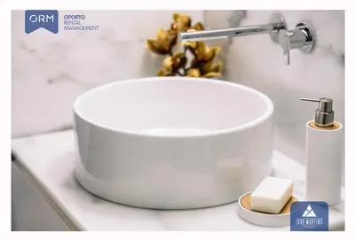 a white sink with a faucet on a counter at ORM - Almada Terrace Apartment in Porto