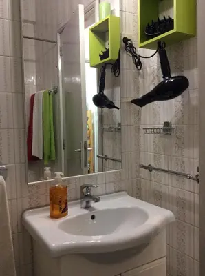 a bathroom with a sink and a mirror at Downtown Sunny Apartment in Porto
