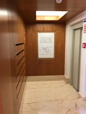a hallway in a building with a sign on the wall at Lux Bolhão - ALL INCLUDED in Porto