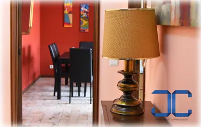 a lamp sitting on a table in a room at Learn Porto Apartment by JC in Porto