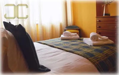 a bedroom with a bed with towels on it at Learn Porto Apartment by JC in Porto