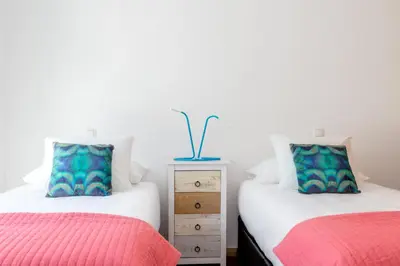 two beds sitting next to each other in a bedroom at Pretty Porto Apartment by SOULSHARING.PORTO in Porto