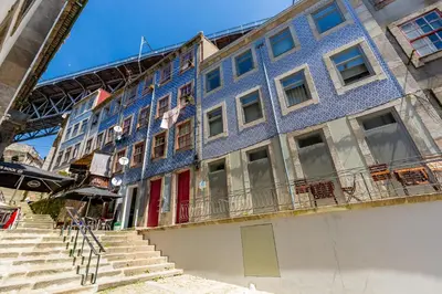a blue building with stairs in front of it at Feel Porto Codeçal Apartments in Porto