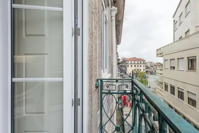 a balcony in a building with a view of a street at GuestReady - Ao Coliseu in Porto