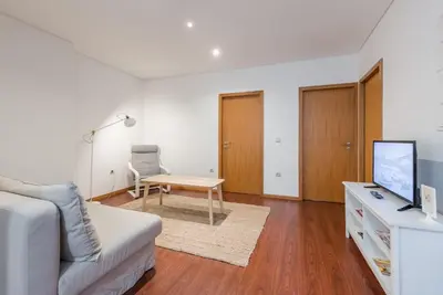 a living room with a couch and a table at GuestReady - Ao Coliseu in Porto