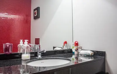 a bathroom with a sink and a mirror at Amazing Amial in Porto