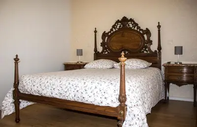 a bedroom with a large bed and two night stands at Amazing Amial in Porto