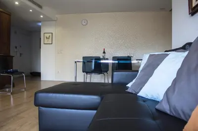 a living room with a couch and a table at Amazing Amial in Porto