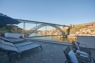 a view of a bridge over a body of water at Bridge It - Suites & Views in Vila Nova de Gaia
