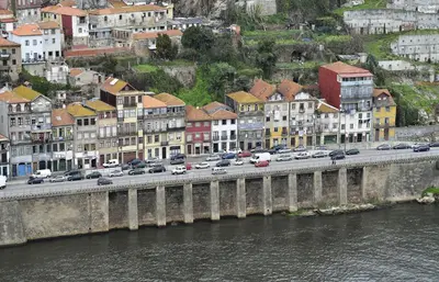a bridge over a river with cars on it at RVA - Gustave Eiffel Apartments in Porto
