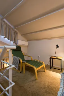 a room with a green couch and a table at RVA - Gustave Eiffel Apartments in Porto