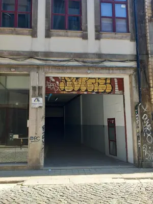 an entrance to a building with graffiti on it at APOSENTUS - Your Home in Martires da Liberdade in Porto