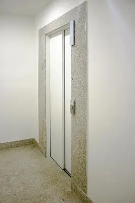 an empty corridor with a door in a building at HM - Carlos Alberto Apartment 3 in Porto